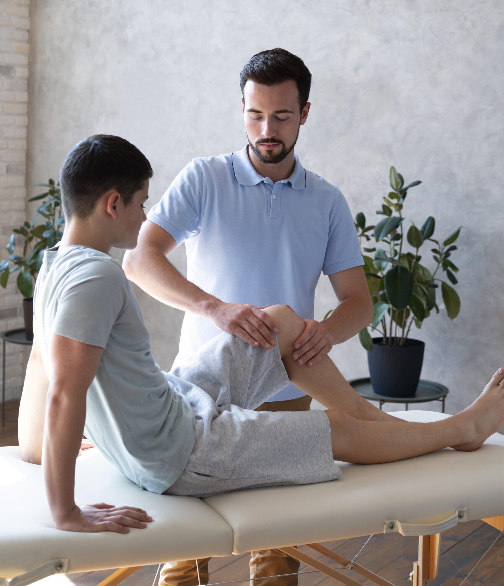 medium shot physiotherapist checking leg